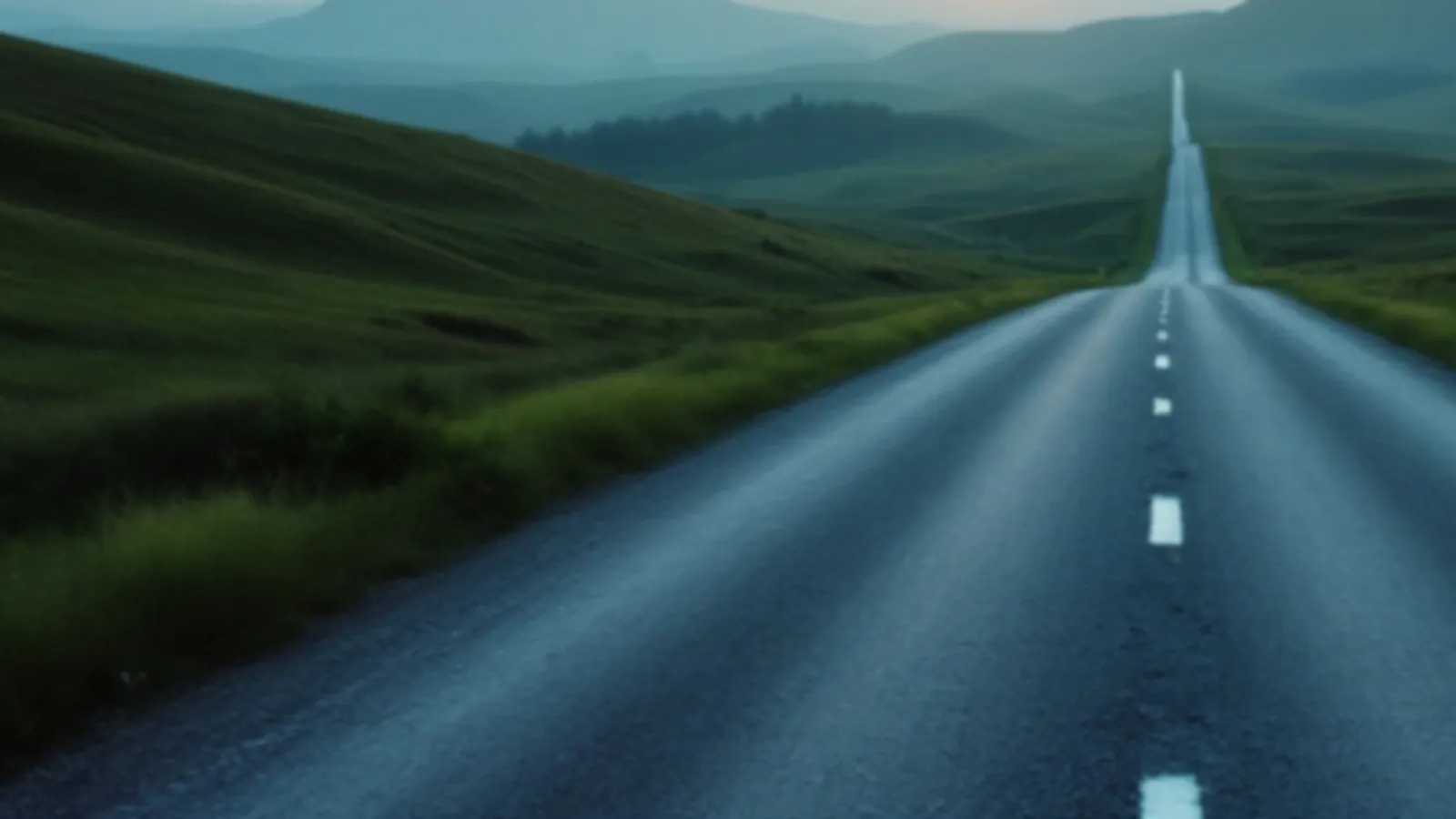 A long empty gravel road across rolling green hills at sunrise, the CarriageMoney view of cash loans online, $100 – $5,000